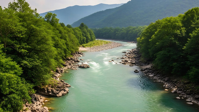 Title: A scenic view of a winding river flowing through a lush green valley surrounded by dense forests and distant mountains under a clear sky - Powered by Adobe