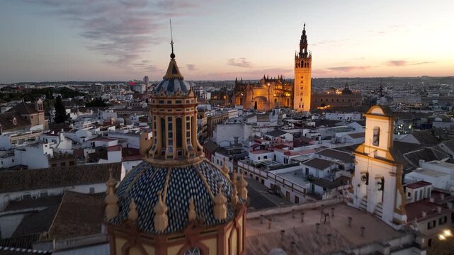Night time aerial view of the historic old town city center of Seville, Andalusia, Spain.
