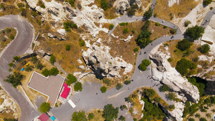 Goreme, Nevsehir, Turkey. Overhead drone view of the historic Monastery of Nuns and Monks, a preserved Byzantine monastic complex in Goreme valley.. Aerial View