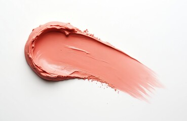 Fototapeta premium Creamy pink blush makeup smear with powder texture detail on isolated white backdrop. Cosmetic product sample shows smooth application and fine particles, perfect for beauty ads.