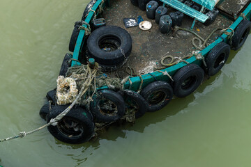tugboat full of used rubber tires