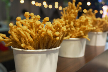 Deep fried enoki mushroom or golden needle mushroom. Sell in central of street food market.
