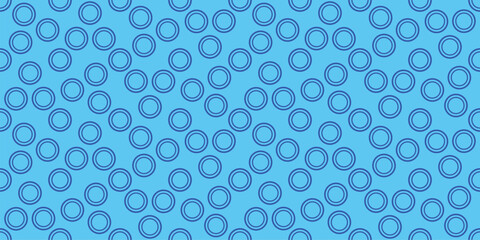 Seamless pattern of light blue circles and rings on a bright blue background. Ideal for fabric, wallpaper, digital papers, and graphic design projects.