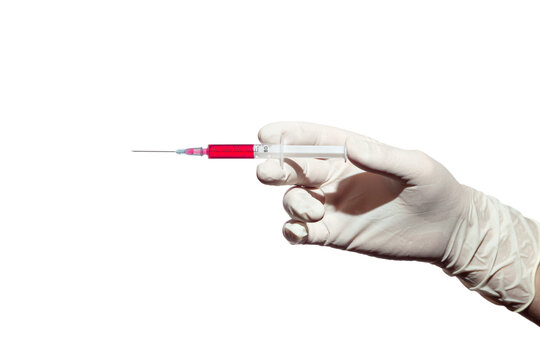 A hand in medical glove holds syringe with red medicine - Powered by Adobe