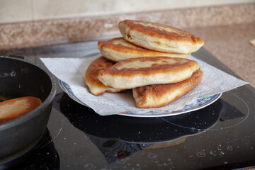 Appetizing fried pies lie on a plate