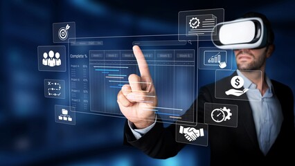 A business professional engages with virtual reality technology to visualize and interact with important data and graphs, embodying innovation and modernity in the workplace. Raster