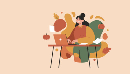 Happy woman working on laptop at desk surrounded by autumn leaves and pumpkins depicting fall business
