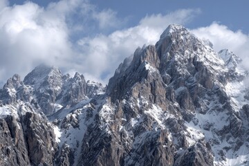 Stunning panorama of rugged Cadini di Misurina mountains showcasing jagged peaks and dramatic clouds in the Italian Alps during late spring