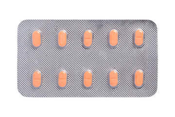 Pills, Orange tablets in a blister pack isolated on white background, top view, Healthcare and medicine concept