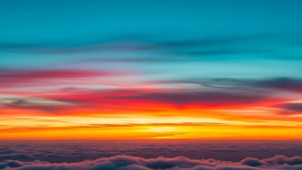 Obraz premium Vibrant sunset over clouds, fiery sky