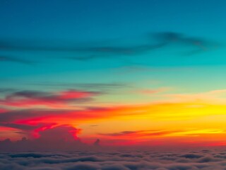 Fototapeta premium Vivid sunset sky over ocean of clouds