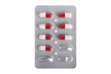 Medicine capsules in a blister pack isolated on white background, top view Healthcare and medicine concept