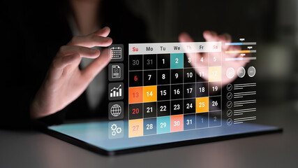 A sleek digital calendar interface displayed on a touchscreen, showcasing hands engaged in...