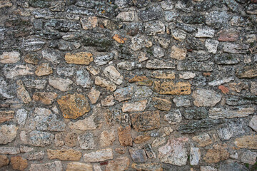 Stone wall of an old and ancient building.