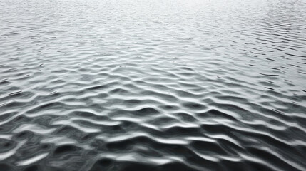 Obraz premium Rippling water surface with soft reflections and moody atmosphere
