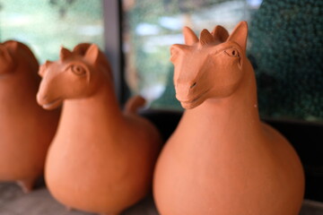 Close-up of terracotta horse sculptures with a shallow depth of field
