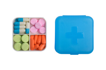 Various pills and capsules in a medicine box isolated on a white background. Concept of medicines and health supplements.