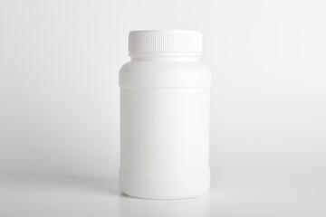 White plastic medicine bottle isolated on white background. Medical and drug concepts.