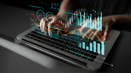 Individual engaged in typing on a laptop with abstract digital graphics displaying various data visualizations and insights, symbolizing modern analytical processes. Scalp