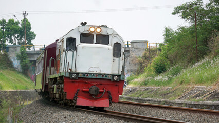 Fototapeta premium A fast-moving train glides smoothly along the railway tracks, showcasing power, motion, and precision in transportation