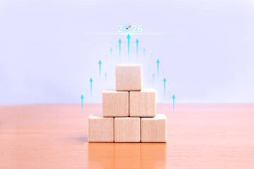 The wooden bar on the chart represents future growth, with upward-pointing arrows indicating year-by-year progress. This symbol conveys financial forecasts and business strategies.