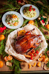 A beautifully roasted turkey sits at the center, flanked by fresh vegetables and seasonal fruits