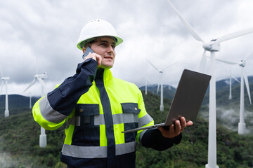 Engineer monitoring wind energy for clean power, carbon credits, and ESG compliance