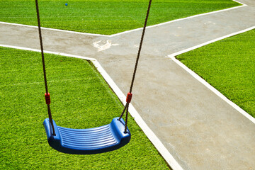 Empty swing hanging in the park