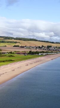 Aerial Pan Over Rosemarkie Beach and Coastal Village in Summer