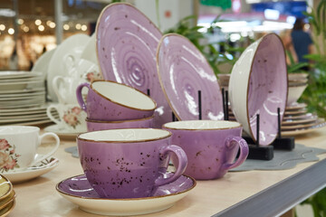 Purple tea set, ceramic tableware in the store.