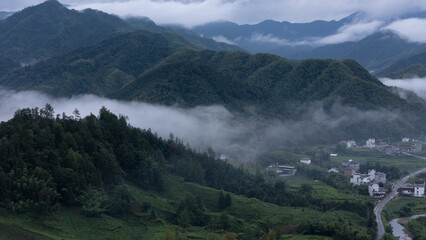 Mountains and villages under the clouds and mist in the early morning of southern Anhui