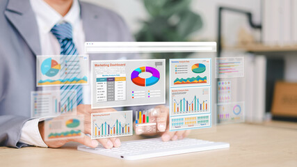 Marketer using digital marketing dashboard with charts, pie graphs, organization chart, and...