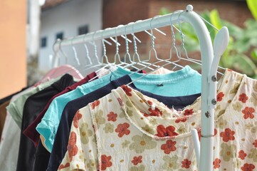 Colorful Clothes Hanging on Outdoor Drying Rack in Natural Light