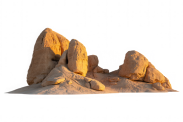 Golden desert rock formations illuminated by warm sunlight against black background