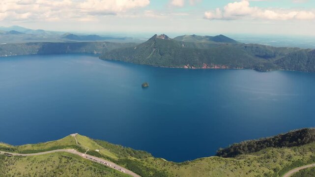 Aerial fly Lake Mashu Caldera in Japan Hokkaido Volcanic Lake, Misty Mountains, slow motion long exposure, Nature