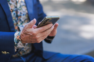 Senior hands using smartphone for digital connection