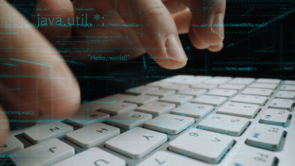 A close-up of hands actively typing on a laptop keyboard with an overlay of programming language text, representing the fusion of technology and creativity in modern coding practices. Xenic