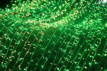 Vibrant abstract background of glowing green light creating an energetic pattern. Magical, festive...