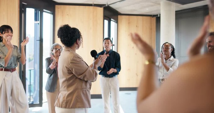 Applause, business and microphone with motivational speaker woman in office for life coaching. Advice, crowd and speech with people clapping in workplace for employee development, pep talk or support