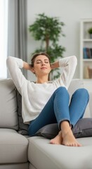 Fototapeta premium Woman resting on sofa with eyes closed peacefully