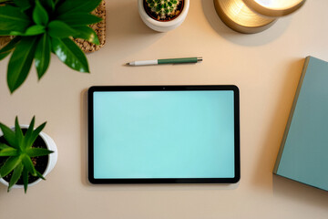 Minimalist workspace with tablet and plants