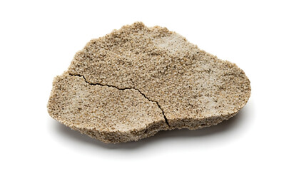Cracked fragment of dried earth or sand with visible texture and a single crack across the surface