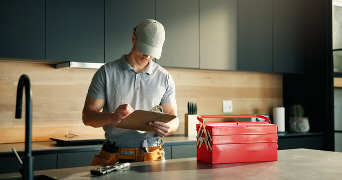 Fototapeta Man, technician and writing on clipboard at house for inspection, plumbing evaluation or report. Male person, toolbox and checklist for home maintenance, diagnostic notes and service costs of repairs