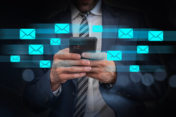 Business Email Communication & Mobile Messaging Technology, A businessman uses a smartphone while digital email icons stream across the image, symbolizing fast communication, email management.