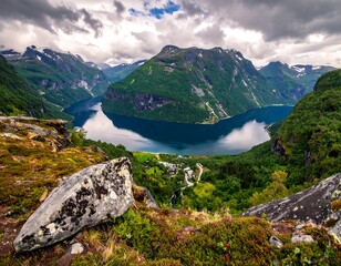 Verdant valley with water reflecting mountainous landscape