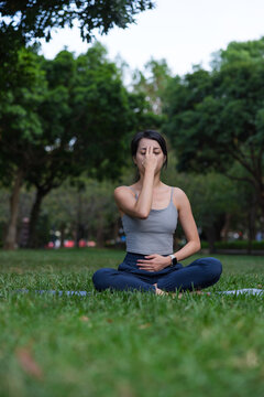 Woman practice pranayama yoga at green park