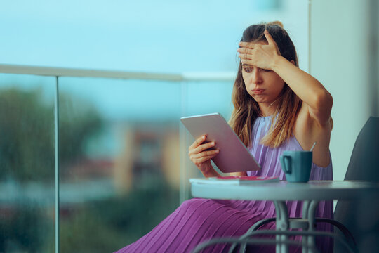 Stressed Woman Checking her PC Tablet Reading the News. Concerned lady being burnout from staying conically online  
