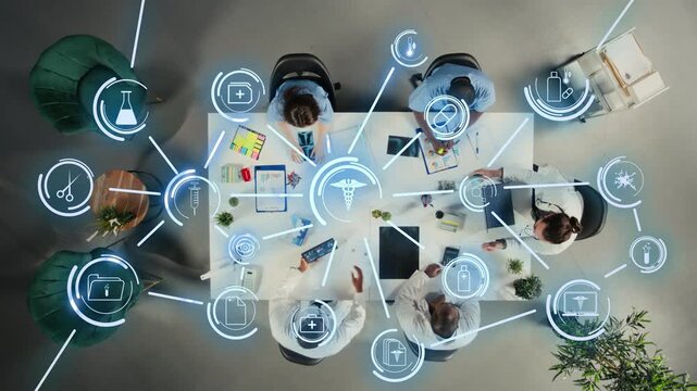 Doctors analyzing clinical trial research with smart health software, concept of digital ecosystem. Top down view of medical team coworkers uploading patient records database on cloud network