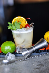 alcoholic cocktail on the bar counter with lime