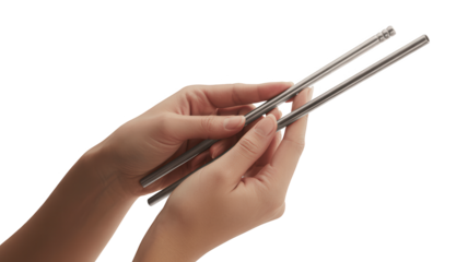 Womans hands holding metal chopsticks isolated on transparent background